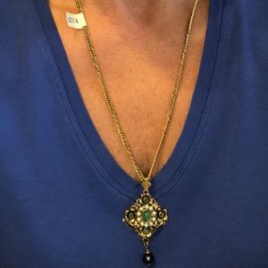 Gold necklace with vintage medallion